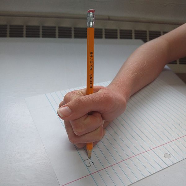 student holding pencil incorrectly before OT therapy services at professional rehab associates