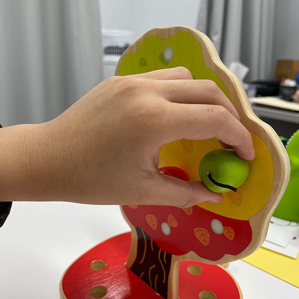 occupational therapy child works through fine motor skills and sensory processing skills