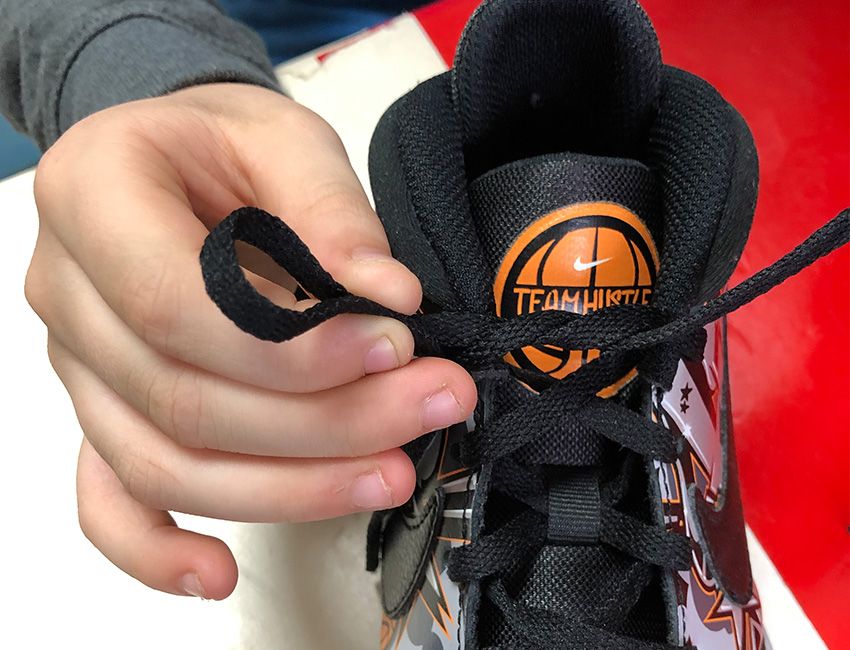 pediatric occupational therapy at professional rehab associates boy tying shoelaces